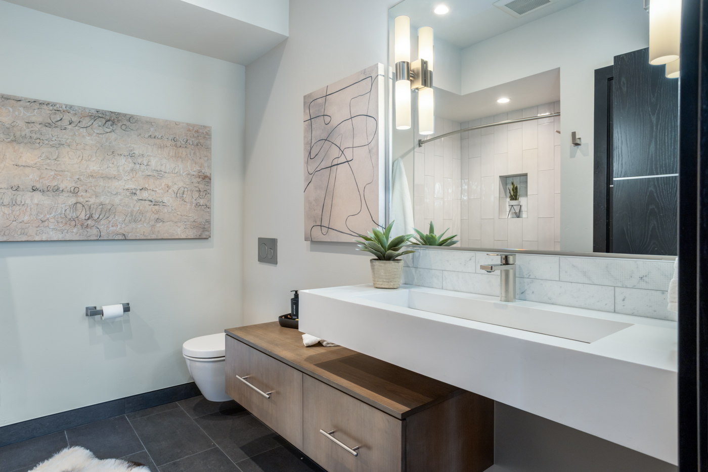 Guest bath with trough sink and marble tile
