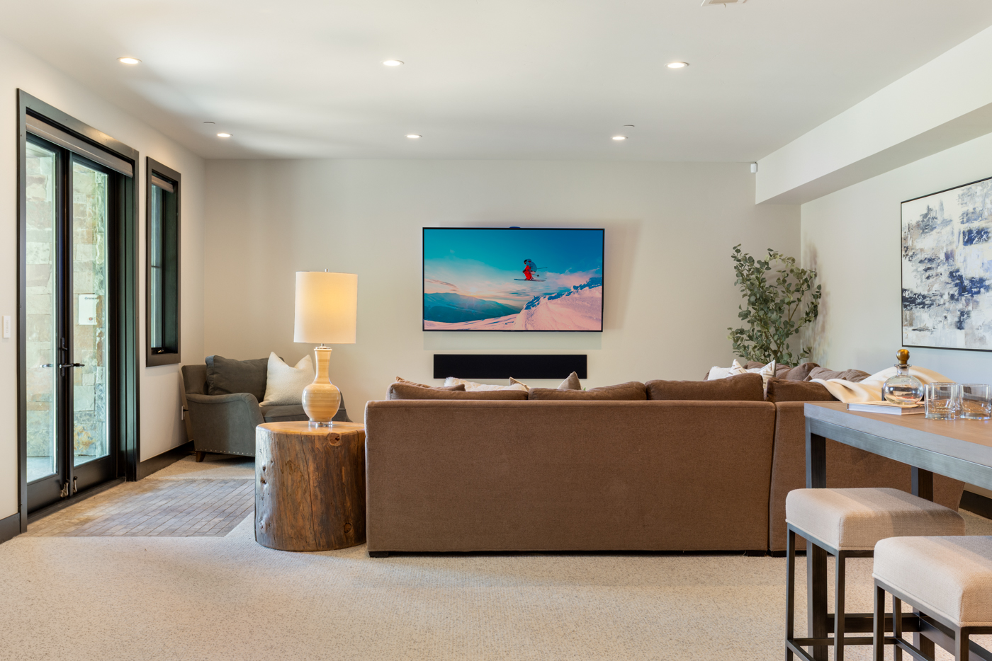 Family room sectional facing the wall-mounted television