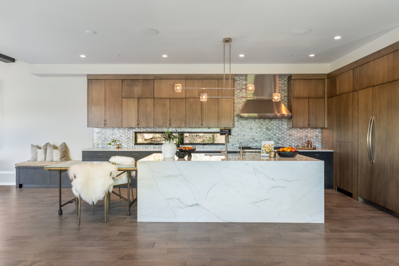 Kitchen island and range with copper hood