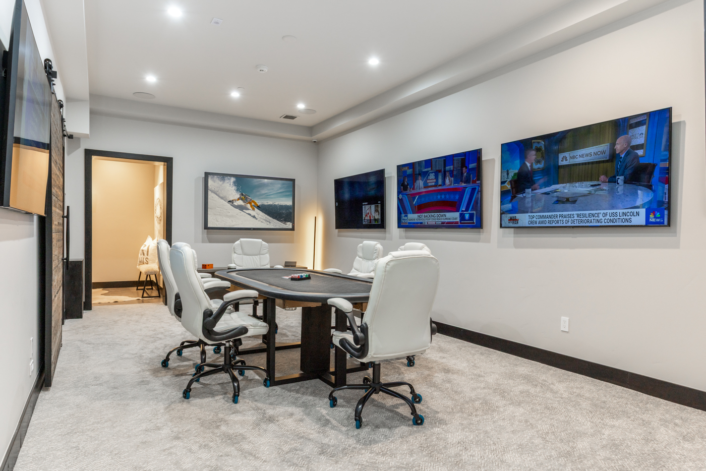 Poker room with multi-screen viewing wall