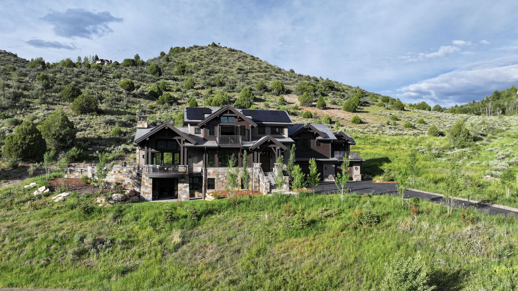 Aerial view of the home on the hillside
